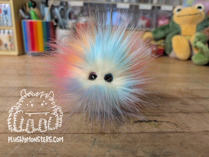 Rainbow Wave Tiny Boi with Pink and Blue Offset Pupil Eyes!